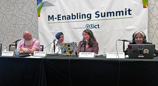 Matthew Luken, Angela Young, Glenda Sims, and Sambhavi Chardrashekar on stage for a panel discussion.